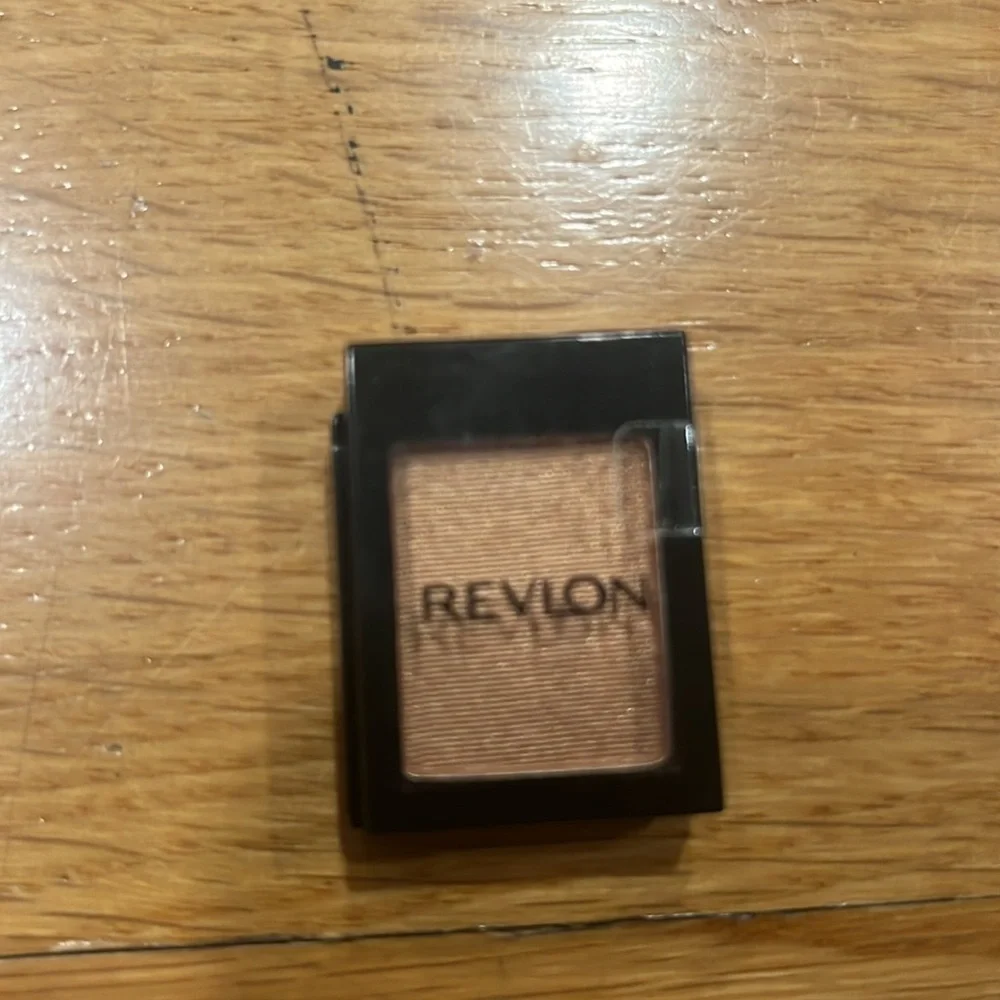 2 Revlon eyeshadows matte plum and metallic copper .
